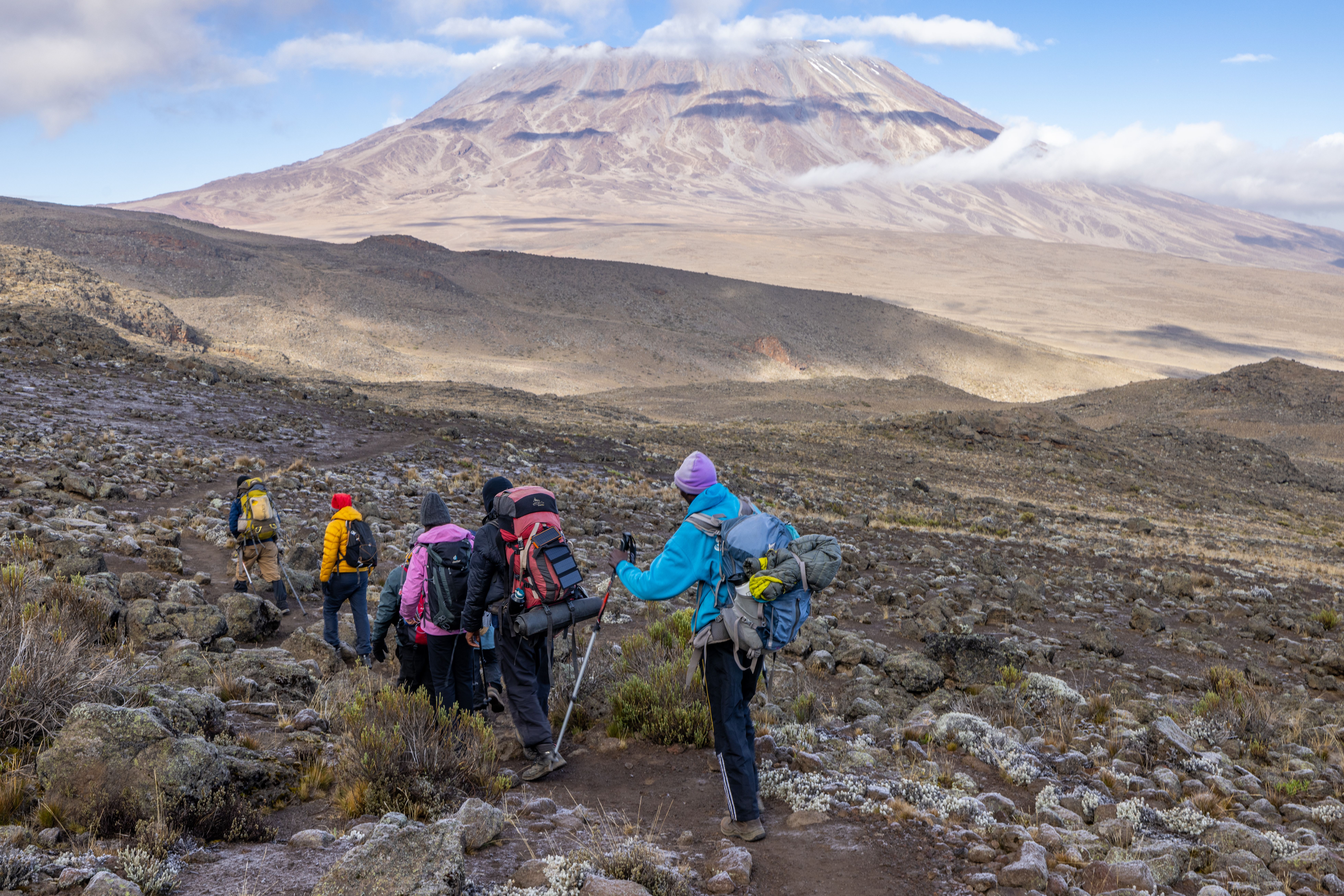 Mount Kilimanjaro snow-capped peak rising above the African plains with dramatic cloudscape
